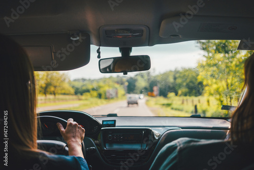 View from the car on the road while driving in the spring