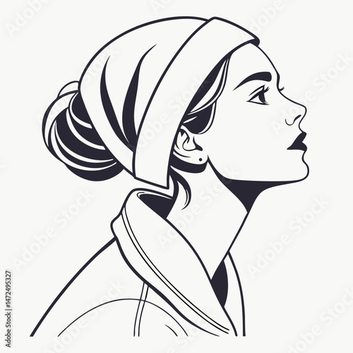 Profile of a thoughtful young woman in a headscarf, symbolizing beauty and contemplation