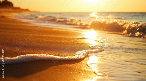 Serene Sunset Over Gentle Waves with Golden Sand and Reflection