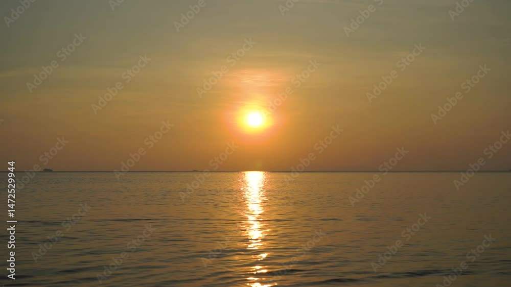 Sunset over tranquil waters at a serene beach in summer Sunset over tranquil waters at a serene beach in summer