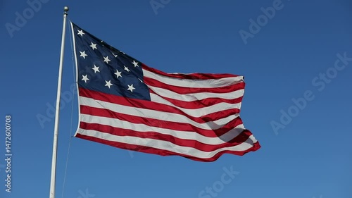 Waving USA Flag in Clear Blue Sky. USA American Flag. Waving United States of America Famous Flag. Sunny Day