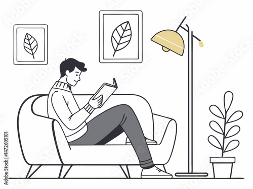 Relaxed Man Reading a Book on a Comfortable Sofa in a Modern Living Room