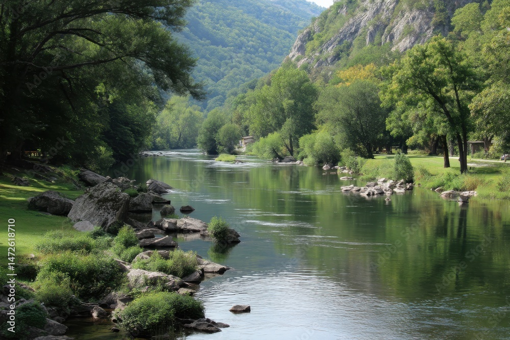 Obraz premium A tranquil river flowing through a lush green valley