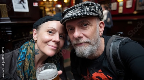 Two friends smile warmly at the camera, enjoying a cozy and cheerful moment at a traditional pub filled with warm lighting and rustic decor.