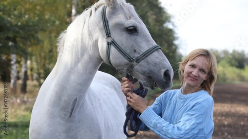 Authentic capture of woman with her pet horse posing to camera. High quality 4k footage