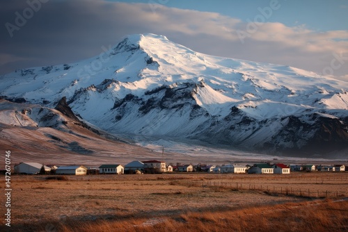 The Infamous EyjafjallajÃ¶kull Volcano Looms Over Thorvaldseyri Village at Sunrise