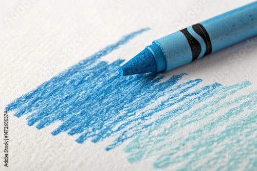 close up of a light blue crayon on white paper with blue scribbles illustration background.