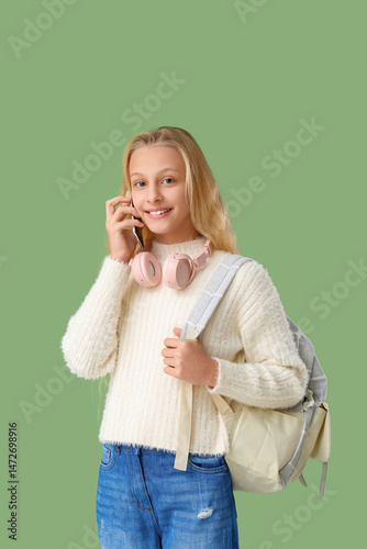Happy teenager girl with ba...