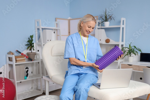 Female physiotherapist with...