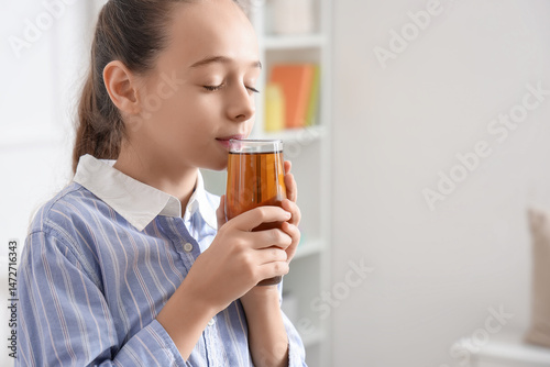 Teenage girl drinking juice...
