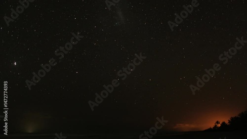 Timelapse of starry night sky with moon