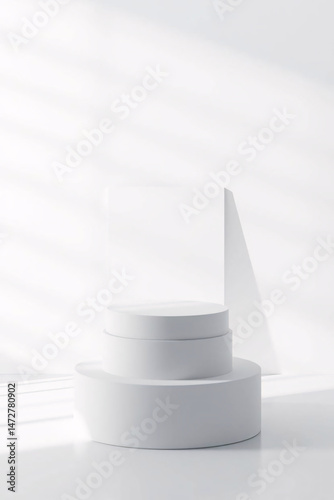 A white cake stand on a white background with minimalist design.