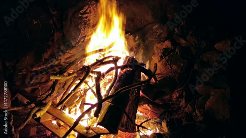 Large fire pit campfire with flames and sparks