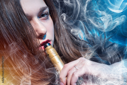 Woman with device. Vape hob...