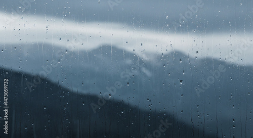 Rain-Streaked View: Abstract Blurred Blue Mountain Landscape with Silver Rain Lines, Moody Watercolor