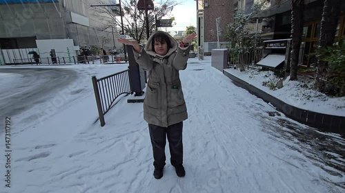 Girl wearing snow clothes in winter setting