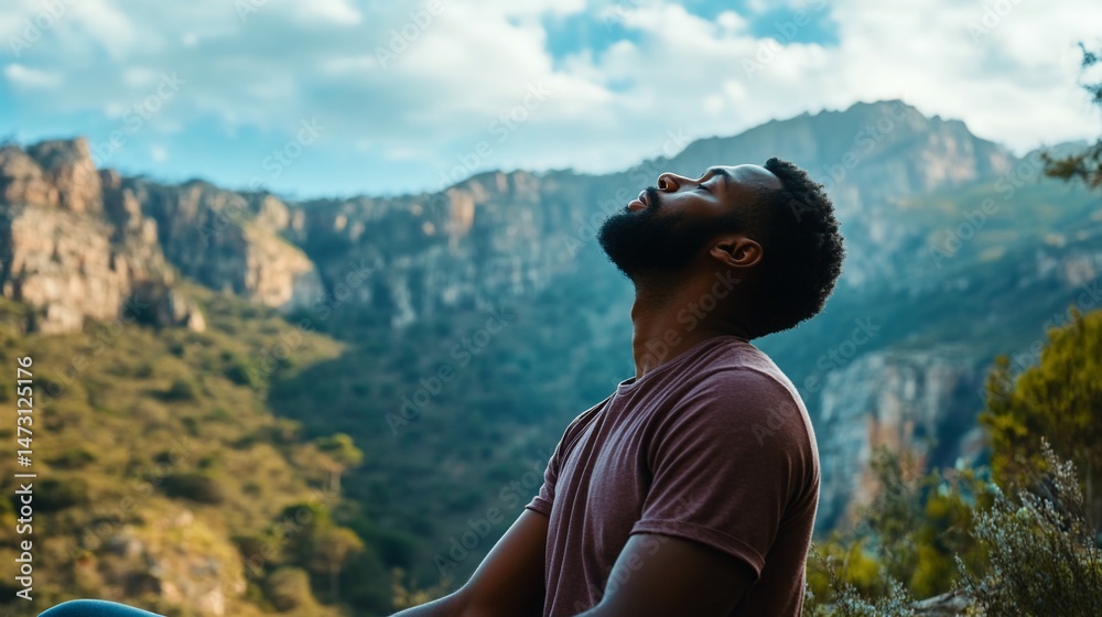 Naklejka premium Young african american man practices mindful meditation in nature
