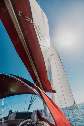 sailing yacht sailing at sunset, Sailing Yacht on Blue Sea Under Clear Sky, Summer Ocean Adventure photo