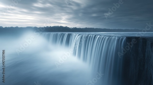 Serene Waterfall Landscape: A Majestic Cascade Under a Cloudy Sky