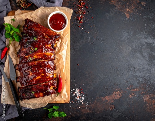 Delicious Barbecue Ribs with Sauce on Wooden Board