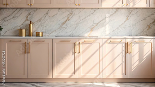 Pastel minimalist kitchen with luxury design, featuring light pink cabinets, gold handles, and marble backsplash illuminated by natural sunlight
