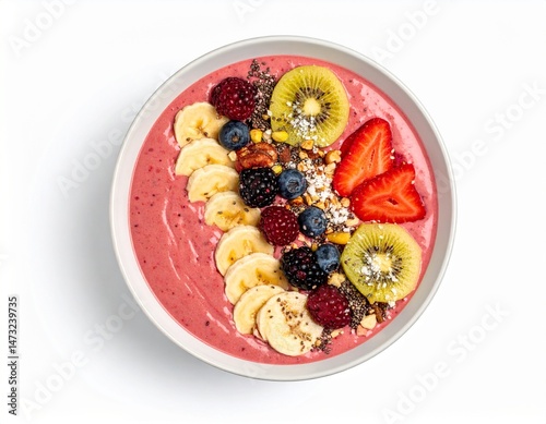 Fruity breakfast bowl! Pink smoothie topped with colorful berries, bananas, kiwi, strawberry, and nut clusters