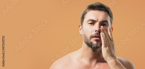 Close up portrait of handsome man. Portrait of shirtless man for skincare and beauty concepts. Handsome man with beauty face, facial skin portrait. Banner for header copy space. Poster for web design.