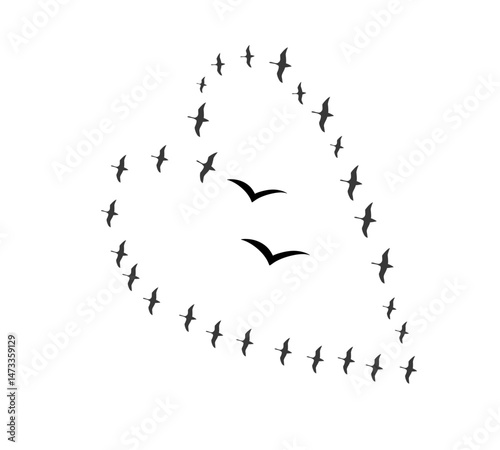 A flock of swallows silhouetted against the sky in graceful flight. Wild Birds Unlimited: your source for bird food, feeders, and expert feeding advice.