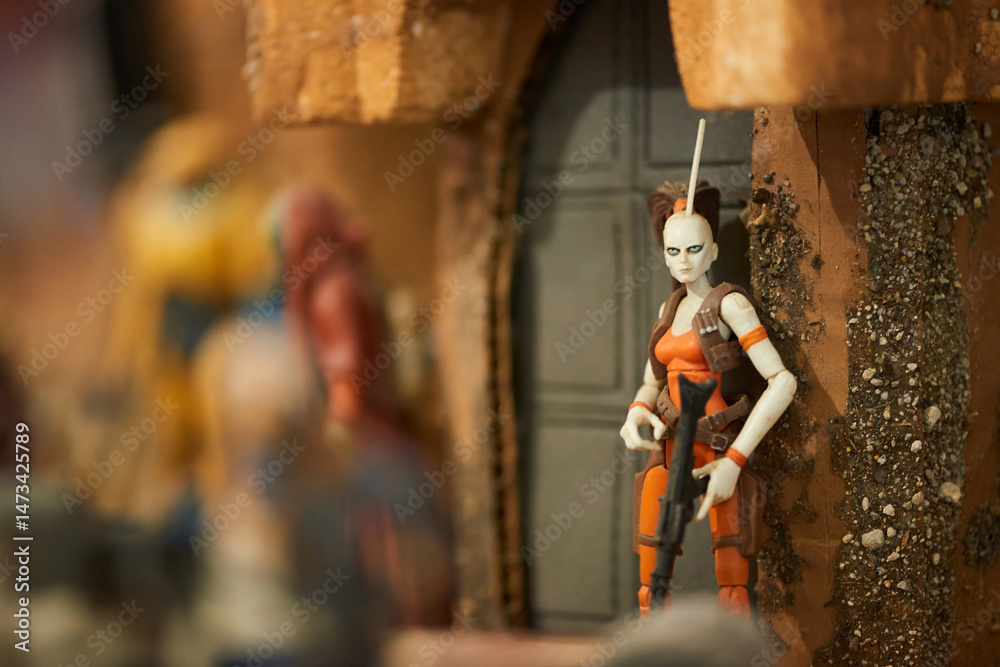 Naklejka premium Aurra Sing bounty hunter figure in Tatooine city, San Salvador, May 4 2025, celebrating Star Wars Day with menacing detail.