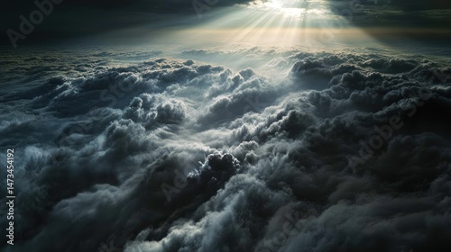 Dramatic view of dark clouds illuminated by sunlight.