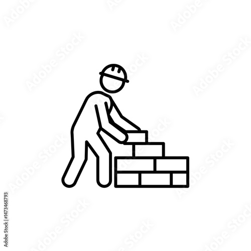 Construction worker stacking bricks on a building site  