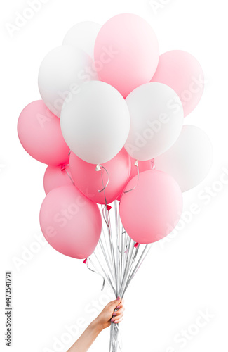 Bunch of pastel pink and white balloons held by a female hand with pink manicure, isolated on white background, festive helium party decoration with silver ribbons for birthday celebration or event