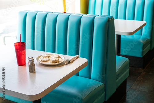 Blue booths in diner with biscuits and gravy