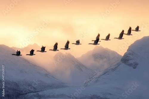 A serene winter scene with a flock of geese flying in formation over snow-covered mountains against a pastel sunset sky.