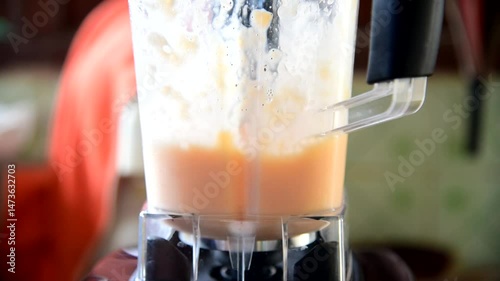 Spinning all raw material of melon smoothie in Blender  