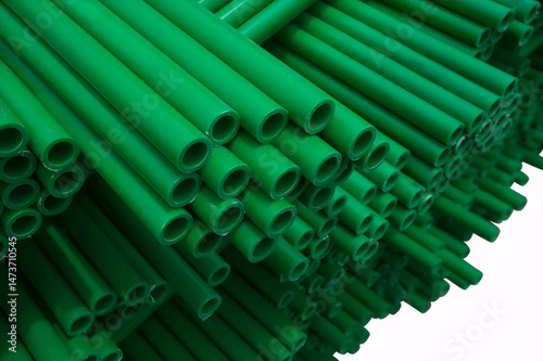 Green Plumbing PVC Pipes Stacked in Orderly Fashion