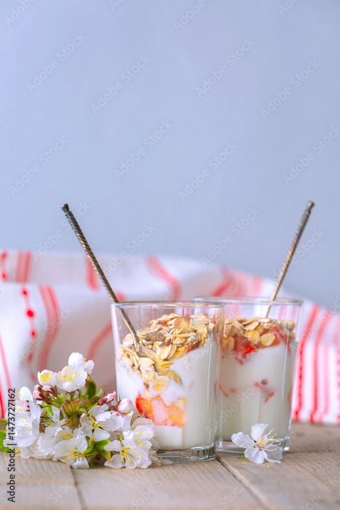 Muesli with yogurt and fresh berries, flowers