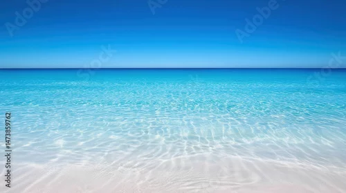 Obraz Clear turquoise water over white sand beach.