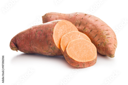 Raw sweet potatoes isolated on white background..