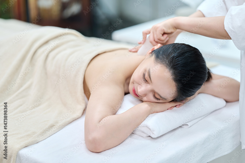Female Gua Sha Back and Shoulder Massage Therapy with Oil at Spa Female Gua Sha Back and Shoulder Massage Therapy with Oil at Spa