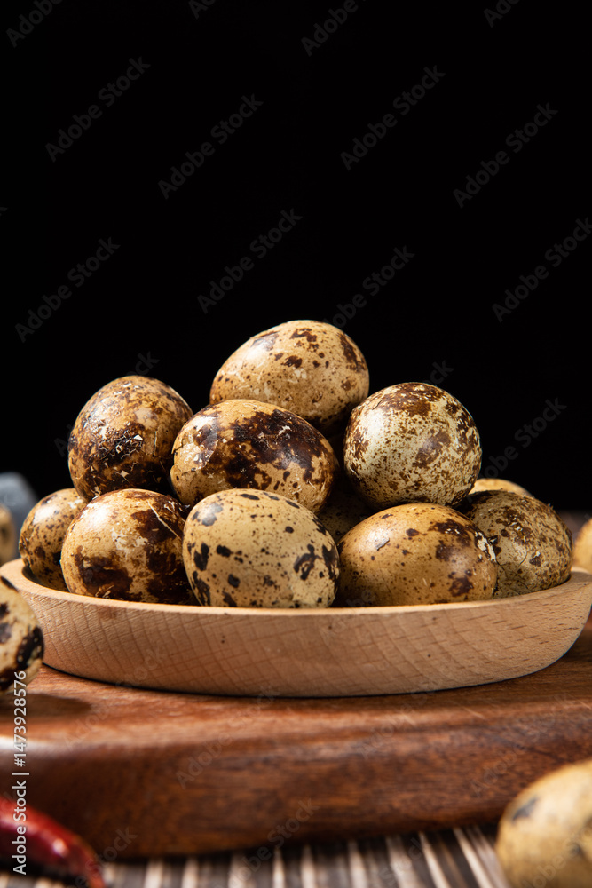 delicious quail eggs snack on wooden table.