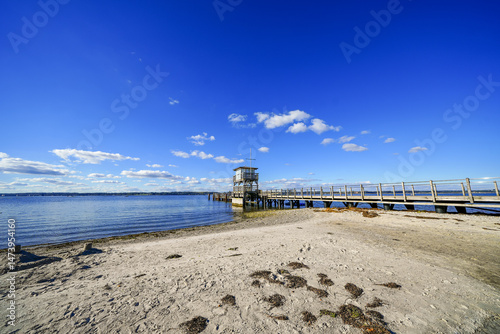 Fototapeta Naklejka Na Ścianę i Meble -  View of the pier and the Baltic Sea near Glücksburg. Landscape on the Flensburg Fjord.
