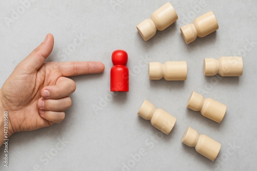 Hand Pointing Red Wooden Figure Among Beige Figures Leadership Concept Business Strategy Selection Choice Decision Making Important Person Unique Individual Employee Team Human Resources Management   