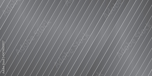 Abstract grey brushed metal texture background with a lined pattern on a steel surface, resembling a metallic wallpaper
