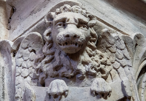 Statue (19th century) of The tetramorph, symbol of the four evangelists with their attributes: the lion for Mark photo