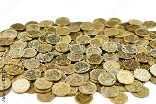 Pile of Ukrainian 10 kopiyok coins, symbolizing economy, finance, and savings.