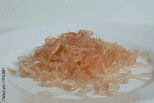 Pomelo orange fruit pulp, on white plate, isolated on white background