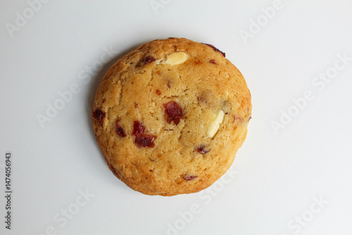 White choco soft cookie with almond and berry cuts, isolated on white background, flat lay or top view