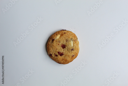 White choco soft cookie with almond and berry cuts, isolated on white background, flat lay or top view