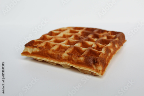 One plain square waffle cake, burnt side, isolated on white background